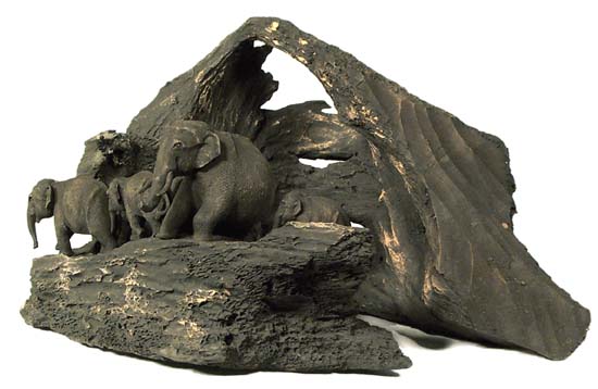 Wooden root with five elephants